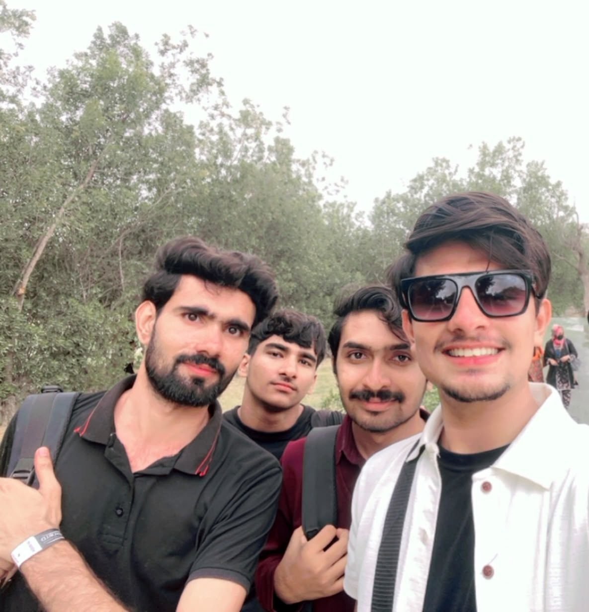 ​Group photo of four friends at an Aptech picnic outing